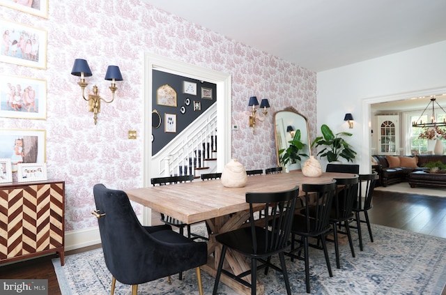 1375 Kirkland Ave, West Chester, PA 19380 - dining space with wallpapered walls, wood finished floors, stairway, and a chandelier