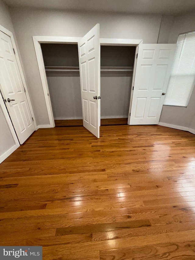 3844 N Franklin St, Philadelphia, PA 19140 - unfurnished bedroom with hardwood / wood-style flooring and multiple closets