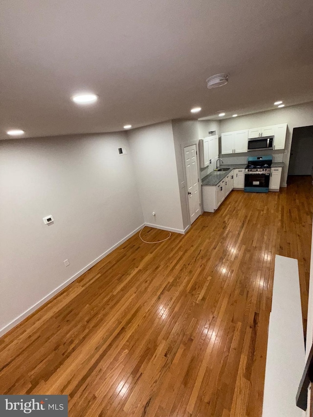 3844 N Franklin St, Philadelphia, PA 19140 - unfurnished living room with light wood-type flooring and recessed lighting