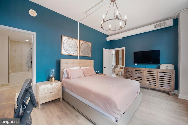 4480 Market Commons Dr Unit 215, Fairfax, VA 22033 - bedroom with a chandelier and wood finished floors
