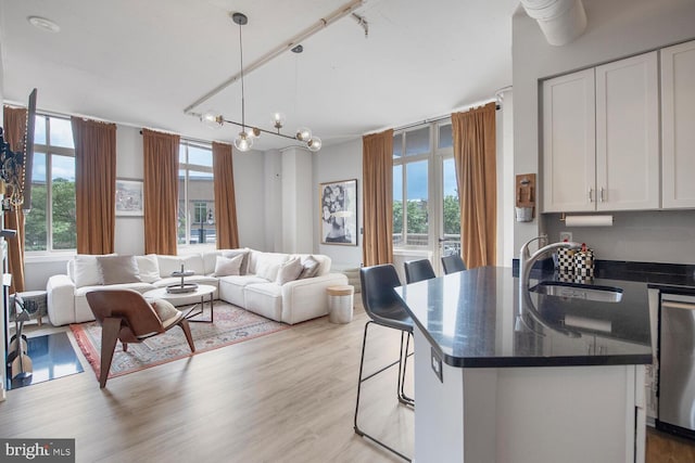 4480 Market Commons Dr Unit 215, Fairfax, VA 22033 - living area with plenty of natural light and wood finished floors