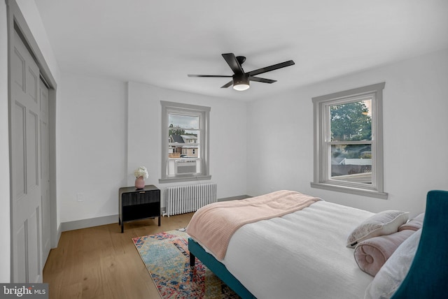 136 W 3rd Ave, Conshohocken, PA 19428 - bedroom with radiator, light wood finished floors, a closet, ceiling fan, and cooling unit
