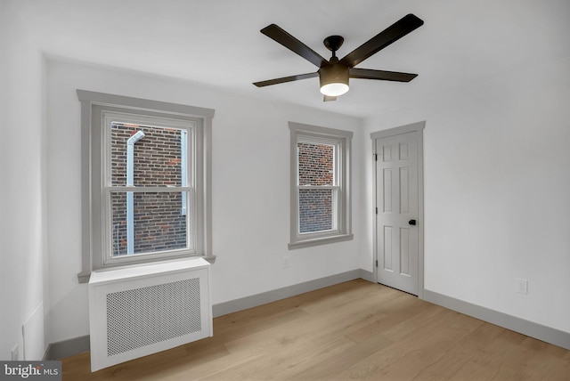 136 W 3rd Ave, Conshohocken, PA 19428 - empty room featuring ceiling fan, light wood-style floors, and radiator heating unit