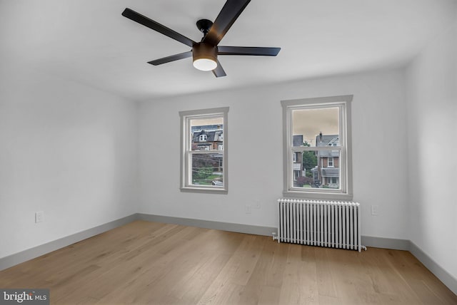 136 W 3rd Ave, Conshohocken, PA 19428 - spare room featuring radiator, wood finished floors, and ceiling fan
