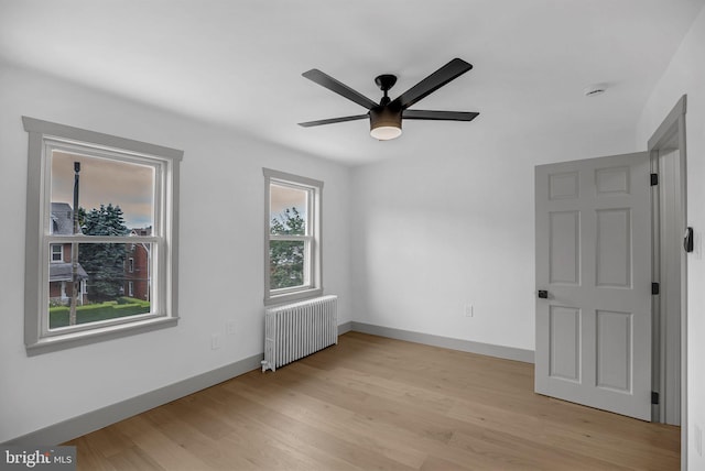 136 W 3rd Ave, Conshohocken, PA 19428 - spare room featuring radiator heating unit, ceiling fan, light wood-style floors, and a smoke detector