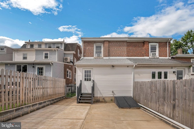 136 W 3rd Ave, Conshohocken, PA 19428 - rear view of property with entry steps, a fenced backyard, a patio, and brick siding