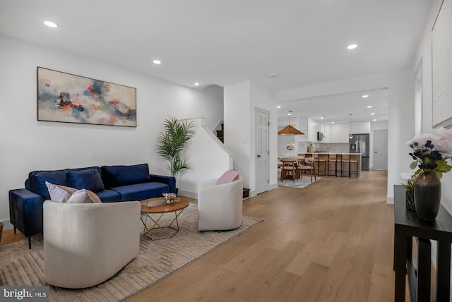 136 W 3rd Ave, Conshohocken, PA 19428 - living room featuring light wood-style flooring, recessed lighting, and stairway