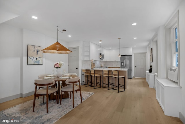 136 W 3rd Ave, Conshohocken, PA 19428 - dining space featuring light wood-style floors, recessed lighting, and cooling unit