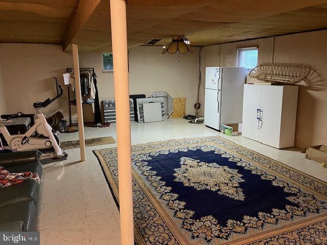 409 Rhoda Dr, Lancaster, PA 17601 - basement featuring freestanding refrigerator and tile patterned floors