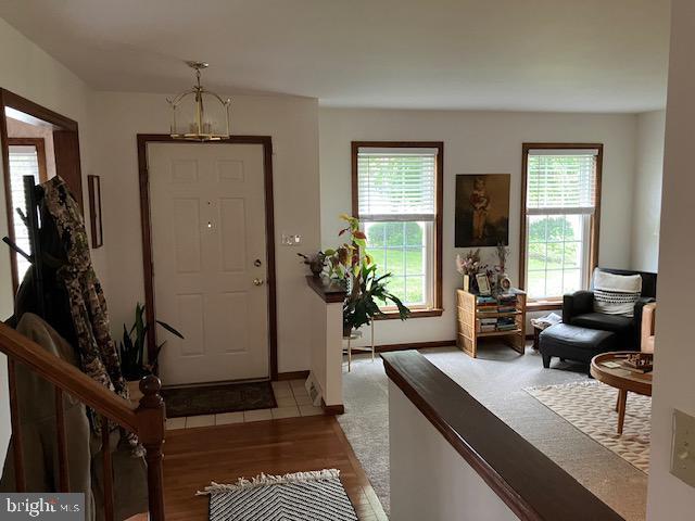 409 Rhoda Dr, Lancaster, PA 17601 - entryway featuring wood finished floors and a chandelier