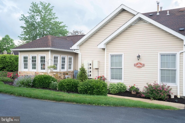 3301 Shellers Bnd Unit 909, State College, PA 16801 - view of front of property featuring a shingled roof and stone siding