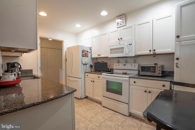 3301 Shellers Bnd Unit 909, State College, PA 16801 - kitchen featuring white appliances, light tile patterned floors, recessed lighting, white cabinetry, and dark stone countertops
