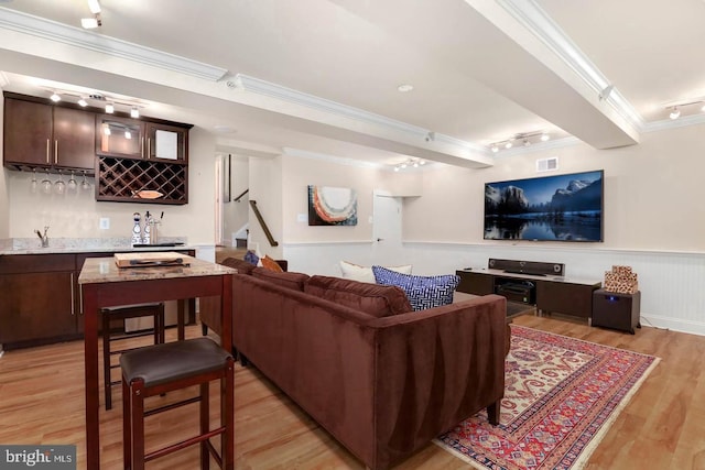 1904 Vermont Ave NW Unit A, Washington, DC 20001 - living area featuring crown molding, wet bar, track lighting, light wood-style flooring, and wainscoting