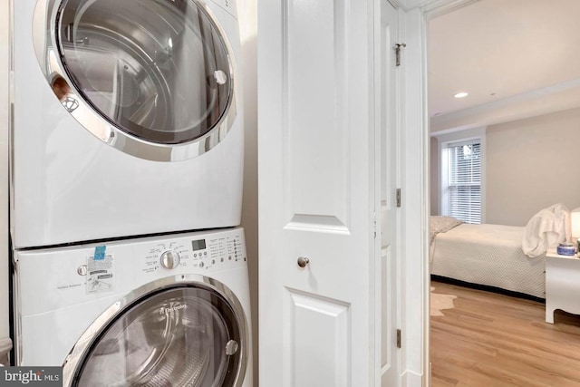 1904 Vermont Ave NW Unit A, Washington, DC 20001 - laundry room with stacked washer and clothes dryer, wood finished floors, and recessed lighting