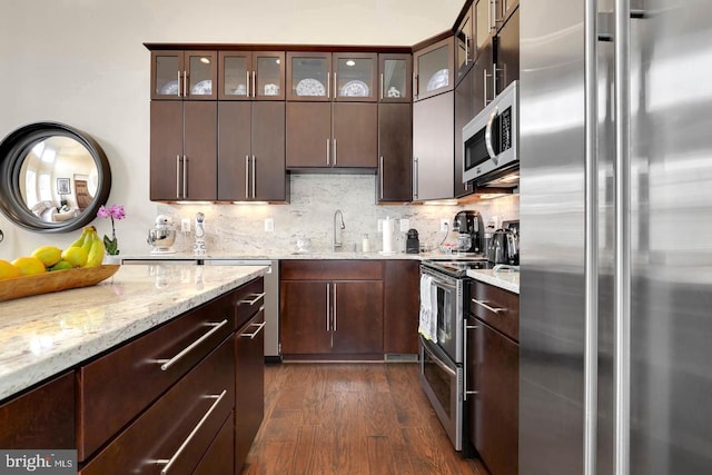 1904 Vermont Ave NW Unit A, Washington, DC 20001 - kitchen with stainless steel appliances, dark wood-style floors, decorative backsplash, and glass insert cabinets
