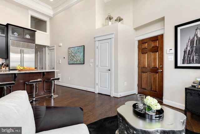 1904 Vermont Ave NW Unit A, Washington, DC 20001 - living area with ornamental molding, a towering ceiling, and dark wood-style floors