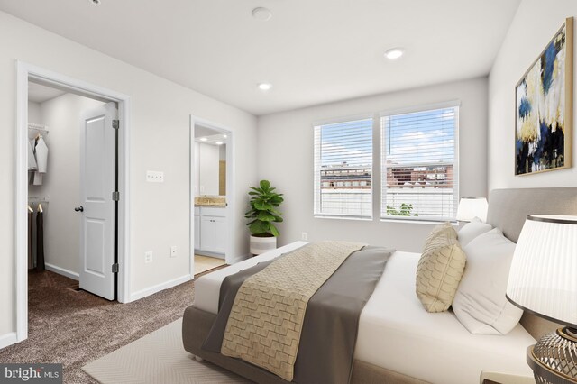 620 Mozart Way, Baltimore, MD 21224 - bedroom with a spacious closet, carpet, ensuite bathroom, and recessed lighting