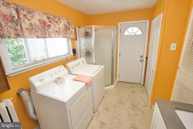 4425 E Howell St, Philadelphia, PA 19135 - washroom with washing machine and dryer and healthy amount of natural light