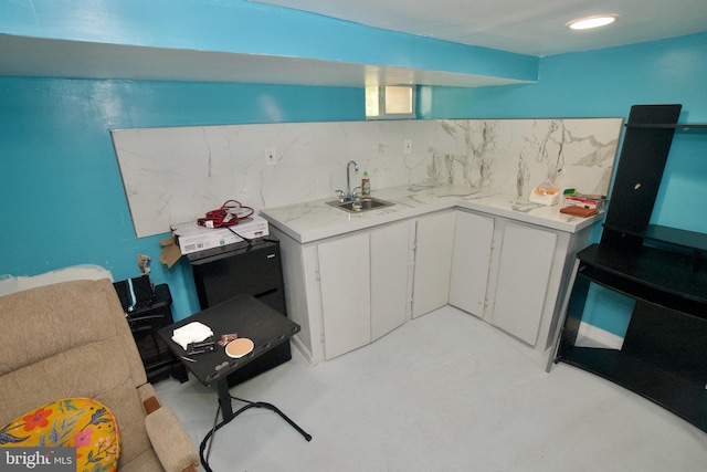 4425 E Howell St, Philadelphia, PA 19135 - kitchen with light countertops, backsplash, and white cabinets