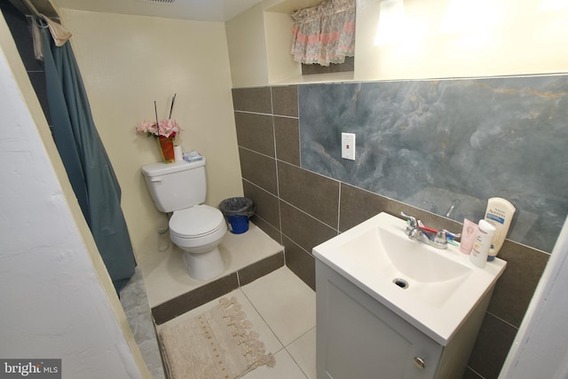 4425 E Howell St, Philadelphia, PA 19135 - full bathroom with tile walls, vanity, tile patterned flooring, and a shower with curtain