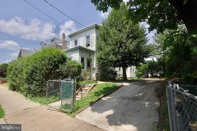 4425 E Howell St, Philadelphia, PA 19135 - view of front of property featuring a gate and concrete driveway