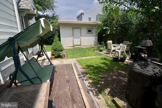 4425 E Howell St, Philadelphia, PA 19135 - view of green lawn featuring a patio and an outdoor structure