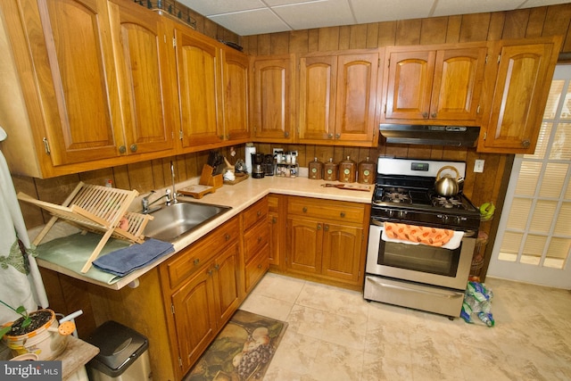4425 E Howell St, Philadelphia, PA 19135 - kitchen with stainless steel gas range, under cabinet range hood, and brown cabinetry