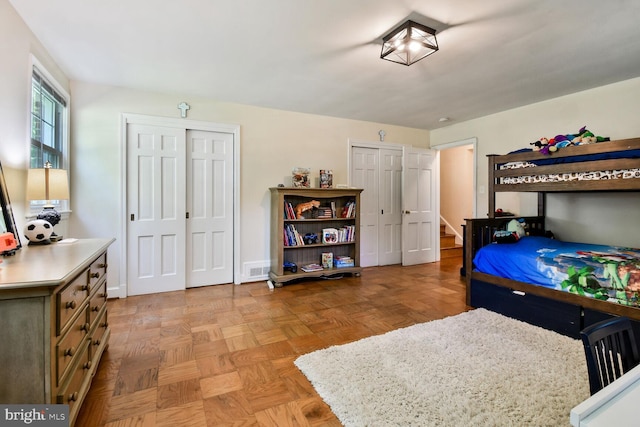 4408 Saul Rd, Kensington, MD 20895 - bedroom featuring two closets and baseboards