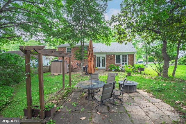 4408 Saul Rd, Kensington, MD 20895 - view of patio / terrace featuring a shed and an outdoor fire pit