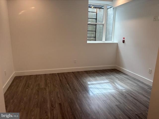 2209 N 7th St, Philadelphia, PA 19133 - empty room featuring dark wood-style flooring and baseboards