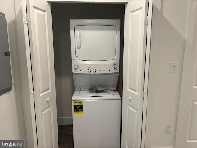 2209 N 7th St, Philadelphia, PA 19133 - washroom with estacked washer and dryer and wood finished floors