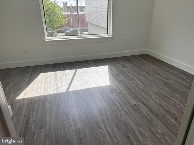 2209 N 7th St, Philadelphia, PA 19133 - spare room with baseboards and dark wood-style flooring