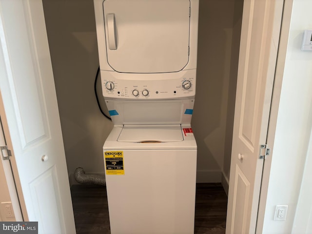 2209 N 7th St, Philadelphia, PA 19133 - laundry area featuring stacked washer / dryer and dark wood-style flooring