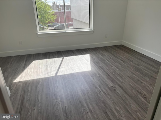 2209 N 7th St, Philadelphia, PA 19133 - empty room with baseboards and dark wood-type flooring