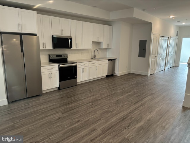 2209 N 7th St, Philadelphia, PA 19133 - kitchen featuring appliances with stainless steel finishes, light countertops, dark wood finished floors, white cabinetry, and electric panel