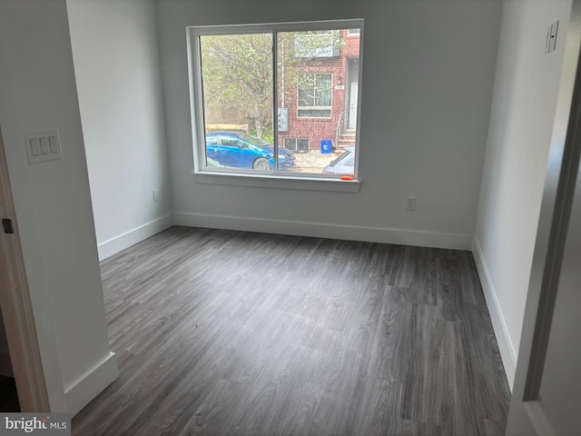 2209 N 7th St, Philadelphia, PA 19133 - empty room with dark wood-style floors and baseboards