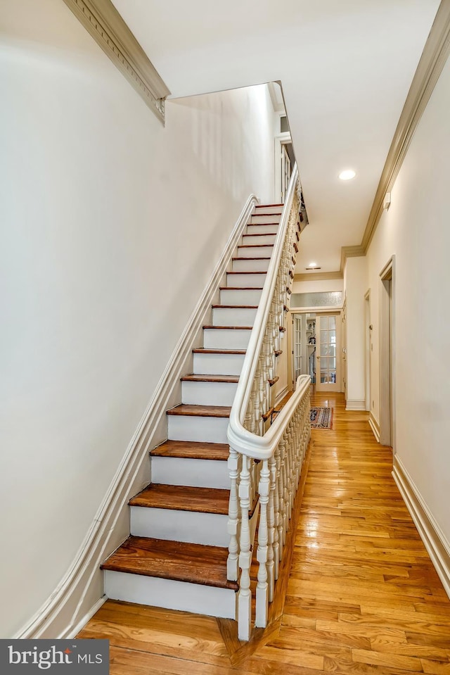 2101 Wallace St, Philadelphia, PA 19130 - stairs featuring wood finished floors, ornamental molding, and recessed lighting