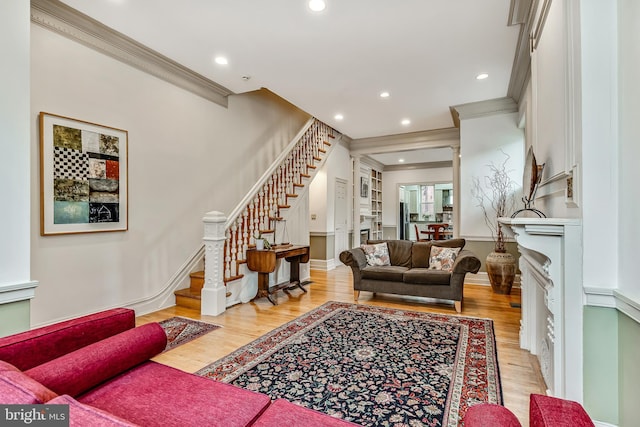 2101 Wallace St, Philadelphia, PA 19130 - living room featuring stairs, crown molding, recessed lighting, and light wood-style floors