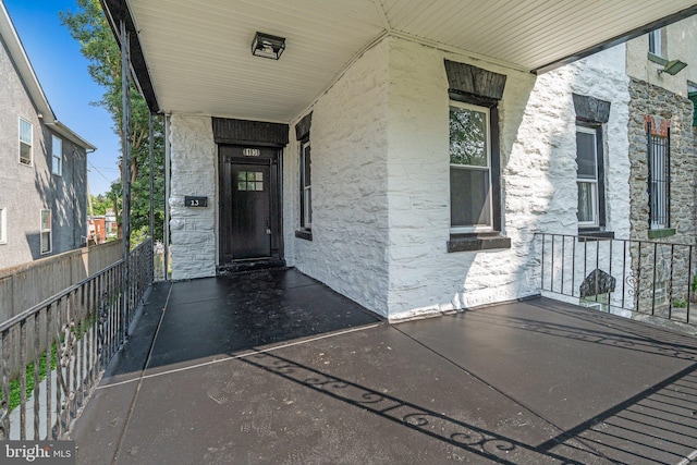 13 W Upsal St, Philadelphia, PA 19119 - property entrance with a porch and stone siding