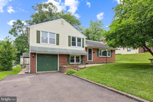 680 Davisville Rd, Warminster, PA 18974 - split level home with asphalt driveway, brick siding, a front lawn, and an attached garage