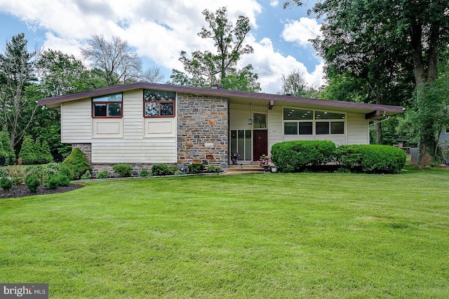 447 Clairemont Rd, Villanova, PA 19085 - view of front of property with stone siding and a front lawn