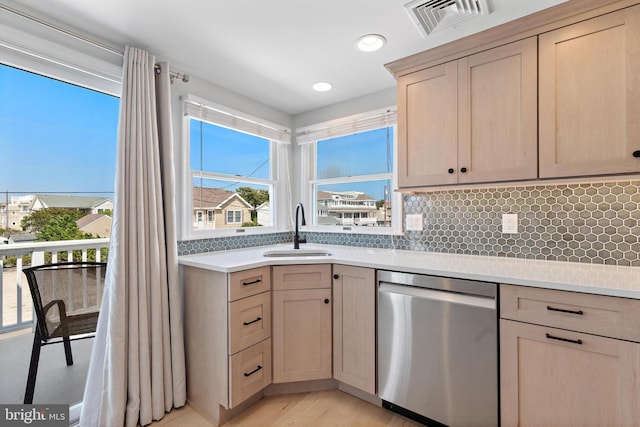 6203 Long Beach Blvd, Long Beach Township, NJ 08008 - kitchen featuring stainless steel dishwasher, light countertops, decorative backsplash, light brown cabinets, and recessed lighting