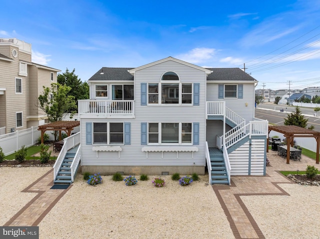6203 Long Beach Blvd, Long Beach Township, NJ 08008 - view of front of home featuring stairway, a pergola, and a shingled roof