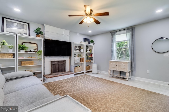 15065 Rock Point Rd, Newburg, MD 20664 - living area with a fireplace, ceiling fan, recessed lighting, and wood finished floors
