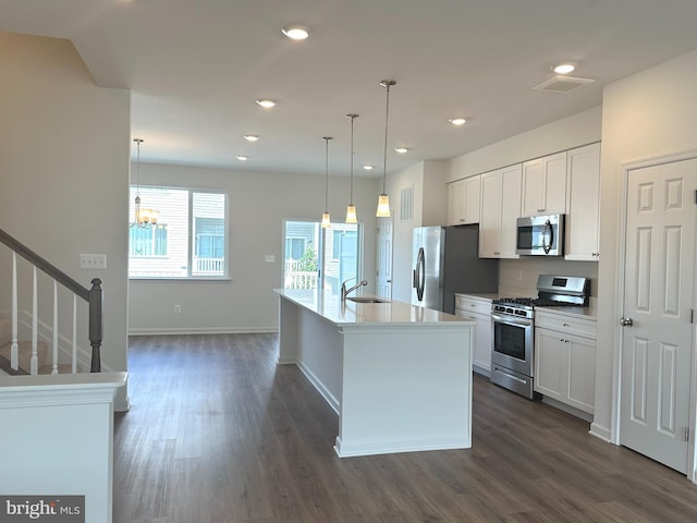 315 Allison Jane Dr Unit G20, Stevensville, MD 21666 - kitchen with stainless steel appliances, dark wood-style floors, a chandelier, recessed lighting, and white cabinetry