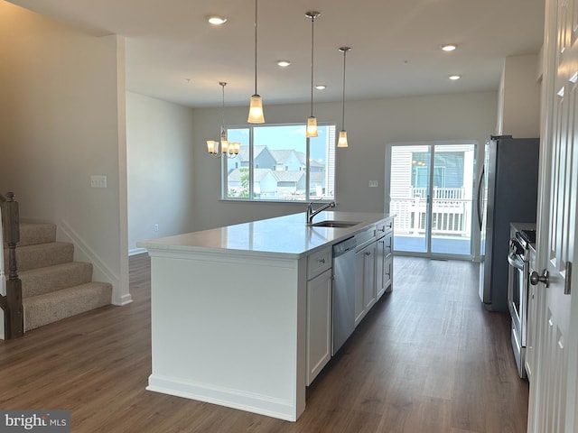 315 Allison Jane Dr Unit G20, Stevensville, MD 21666 - kitchen with appliances with stainless steel finishes, dark wood finished floors, a center island with sink, light countertops, and white cabinets