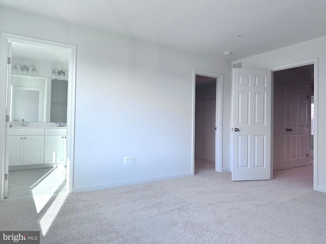 315 Allison Jane Dr Unit G20, Stevensville, MD 21666 - unfurnished bedroom featuring carpet, a spacious closet, ensuite bath, and a closet