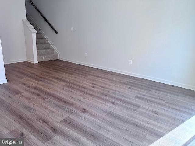315 Allison Jane Dr Unit G20, Stevensville, MD 21666 - unfurnished living room with wood finished floors and stairway