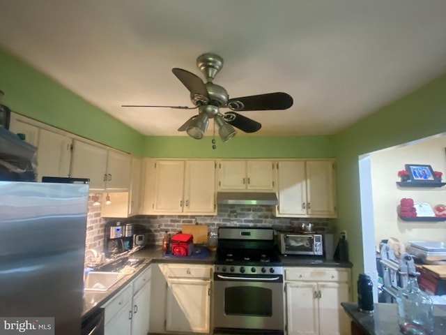 3104 S Battlebridge Dr, North Chesterfield, VA 23224 - kitchen featuring appliances with stainless steel finishes, under cabinet range hood, dark countertops, and backsplash