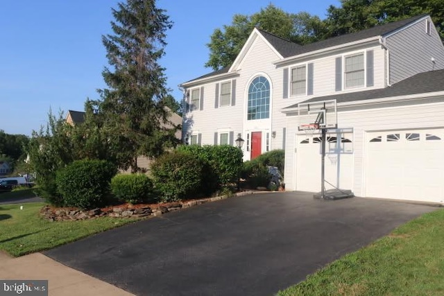 3861 Wertz Dr, Woodbridge, VA 22193 - colonial-style house with asphalt driveway and a garage